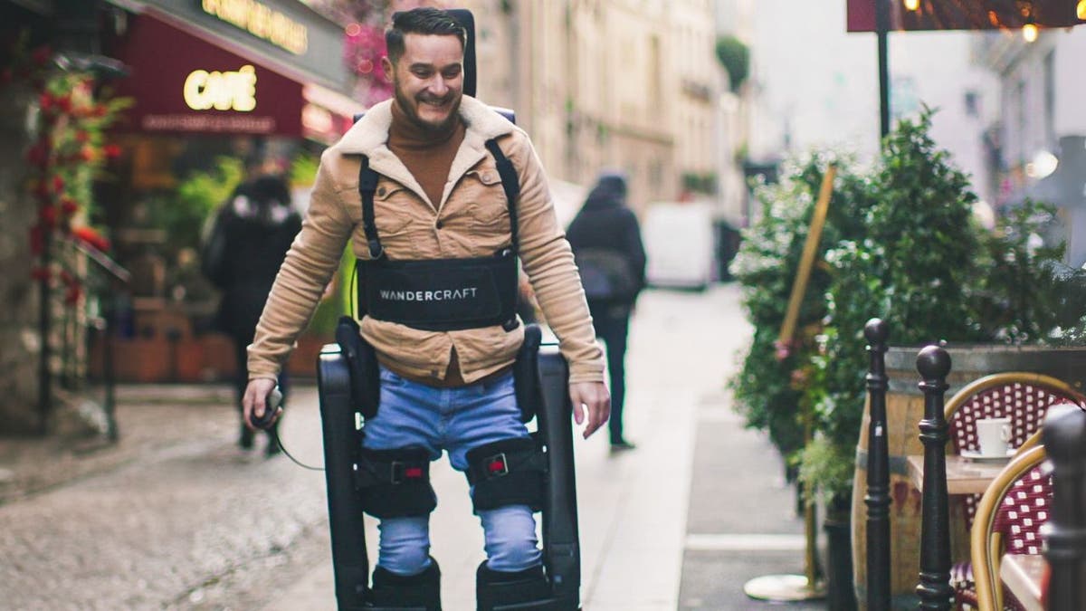 A man using an exoskeleton to walk.