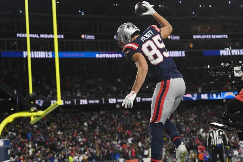 New England Patriots tight end Hunter Henry celebrates after catching a 28-yard pass for a touchdown against the Los Angeles Chargers in the fourth quarter of an NFL wild card playoff game Sunday at Gillette Stadium in Foxborough, Mass. Photo by Amanda Sabga/UPI